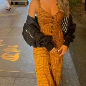 Urban outfitter tan and black jumpsuit sz small